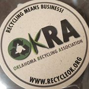 OKRA coaster stone coaster with OKRA logo on it